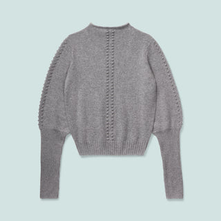 Gray sweater with unique textured details on the sleeves and back